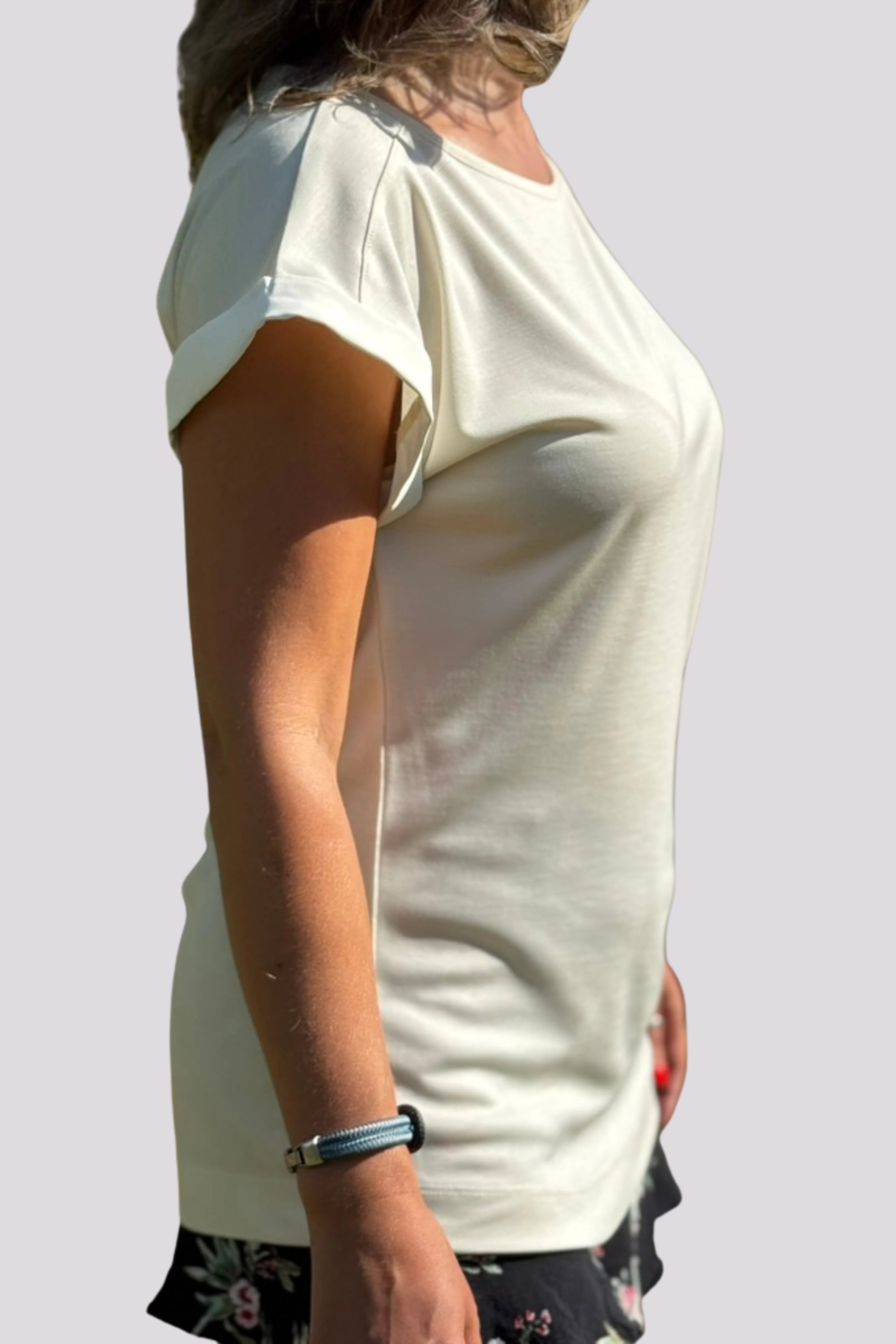 Side profile of the P’tit Affair Millie T-shirt in Classic Pearl white, designed for petite women with a relaxed fit and flattering sleeve cut
