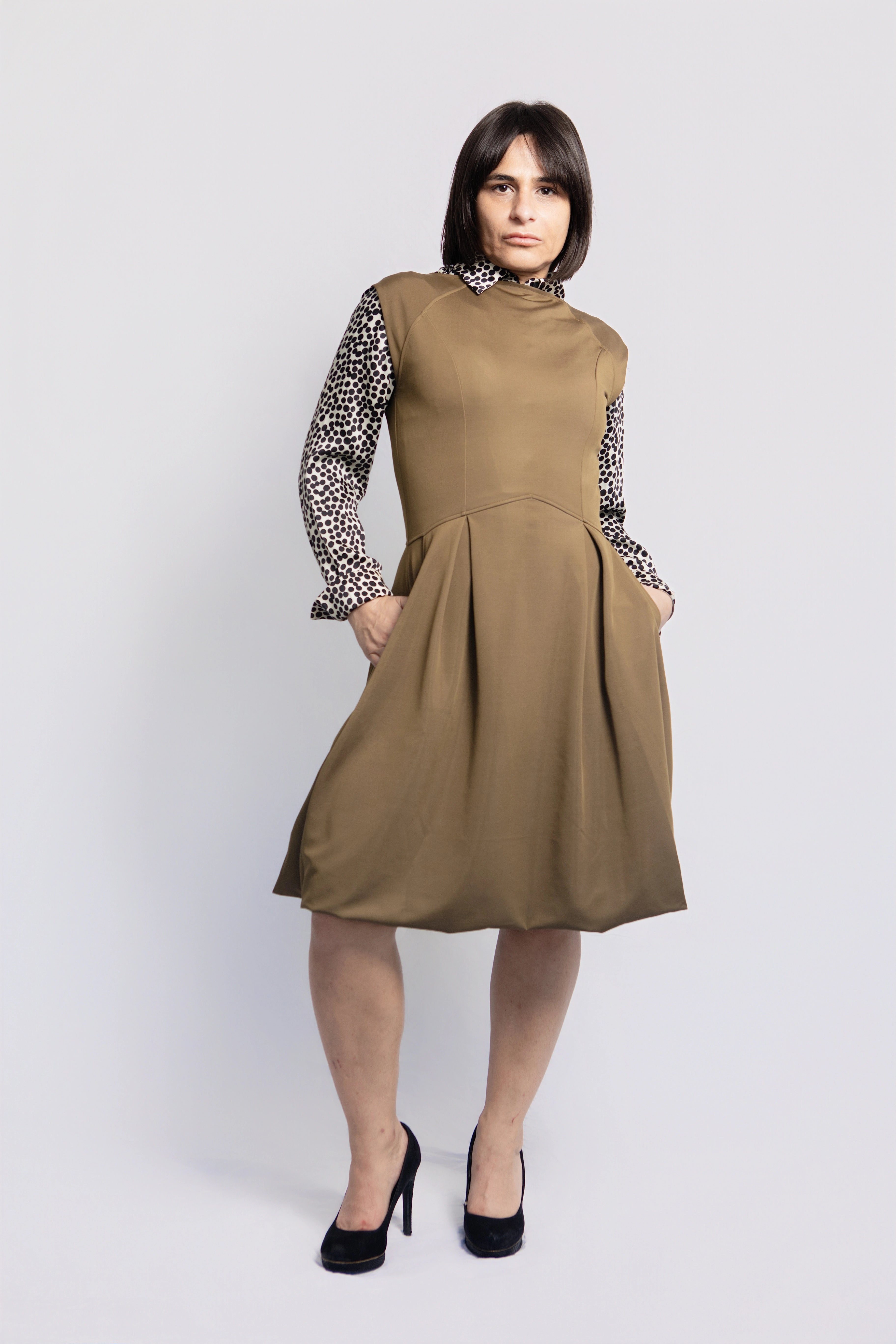 Front view of petite olive green midi dress with pockets, sustainable fashion for women under 5'3, versatile outfit styled with patterned blouse, made in Portugal